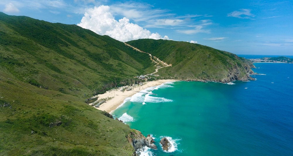 The crystal-clear, turquoise waters at Ky Co Beach are truly breathtaking
